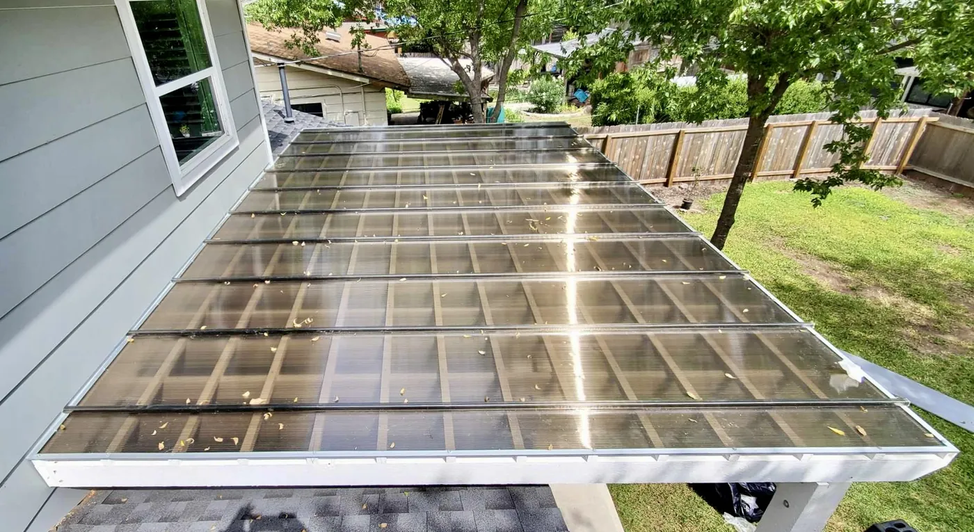 Bronze Hercules polycarbonate roof installed over an existing pergola