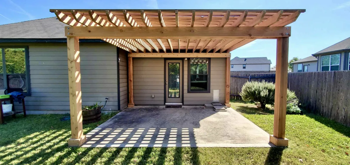 Freestanding cedar pergola on an existing concrete patio