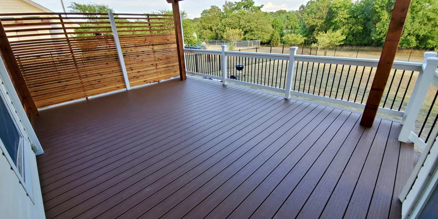 Composite deck with railing and cedar privacy wall