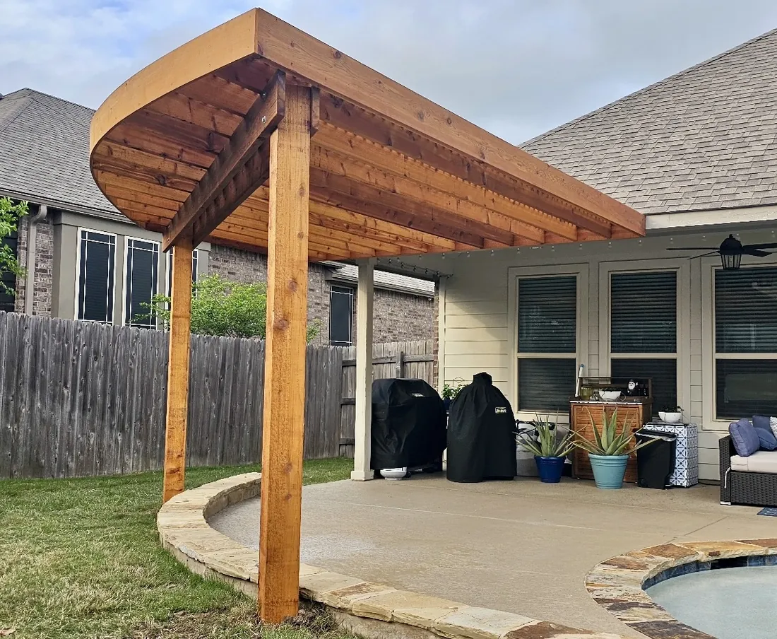 Curved radius-shape cedar pergola attached to the home