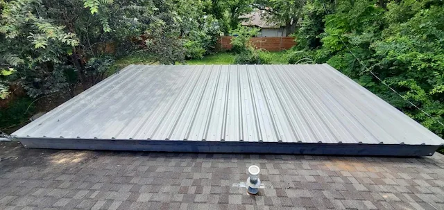 Aerial view of a galvalume metal roof carport