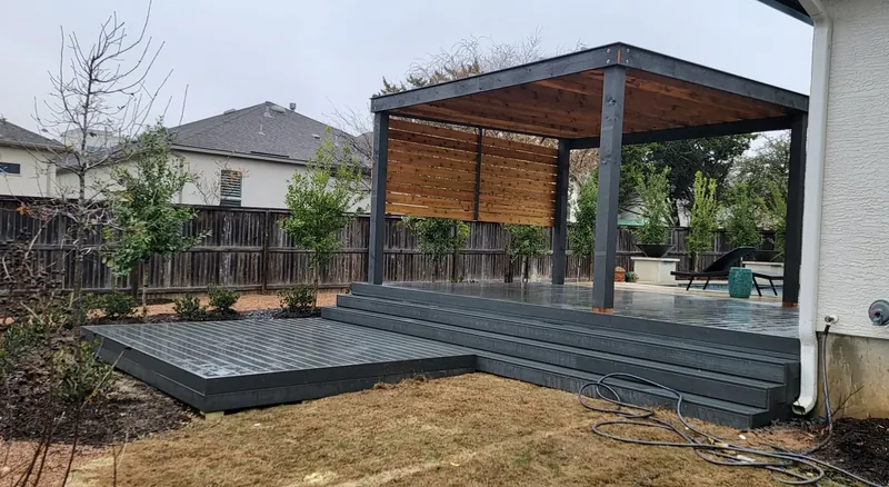 Gray composite deck with modern pergola near Denver, CO