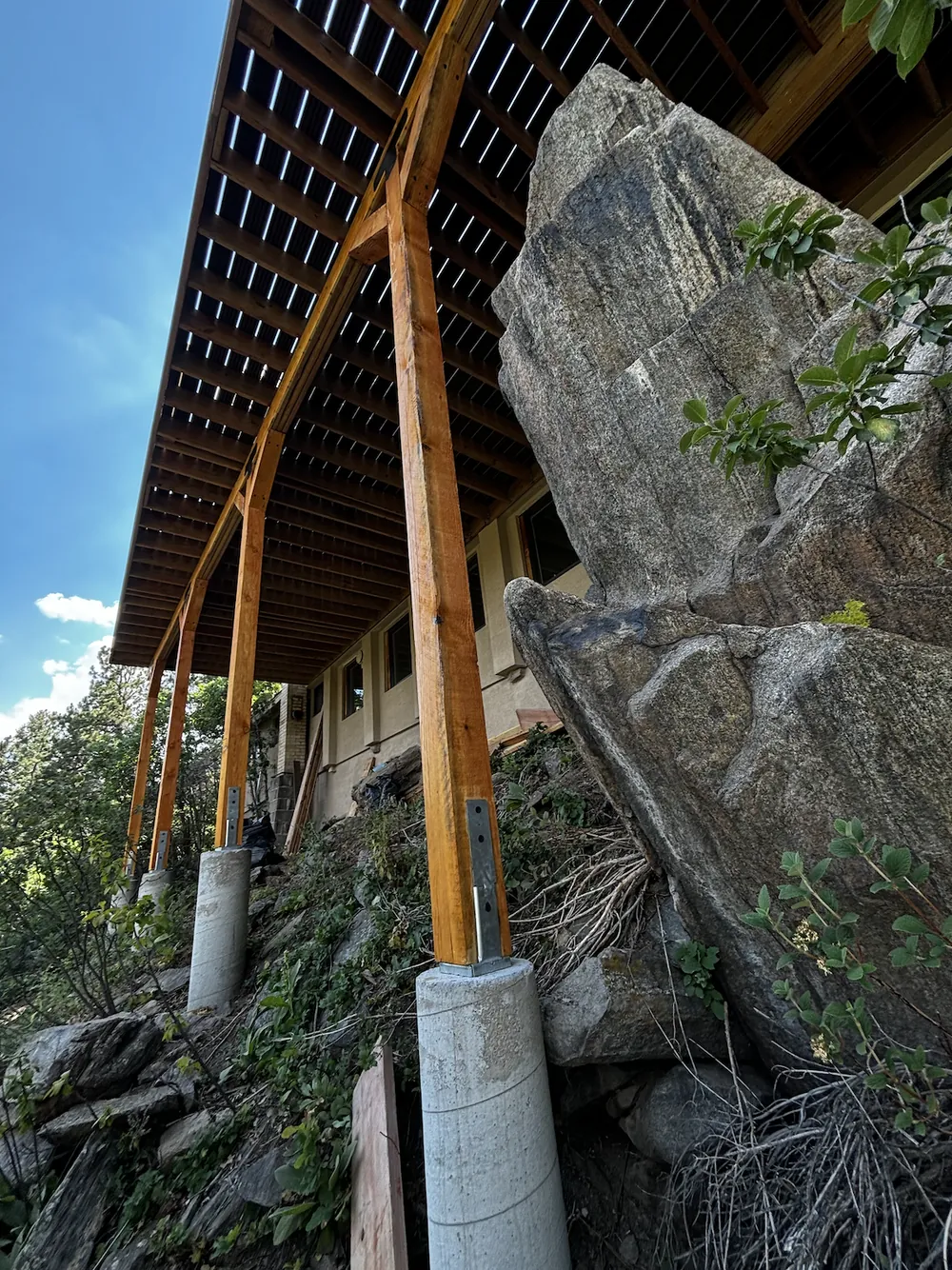 Second-floor deck built into a granite hillside near Morrison, CO