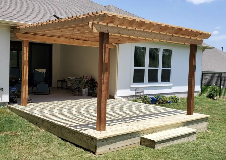 Unstained pressure-treated pine deck with cedar pergola